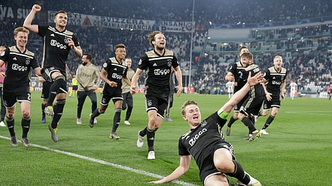 Ajax’s Matthijs de Ligt and teammates celebrate at the end of the Champions League, quarterfinal, second leg soccer match between Juventus and Ajax, at the Allianz stadium on Tuesday, April 16, 2019.