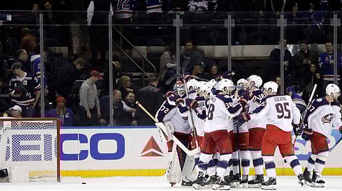 Blue Jackets celebrate shootout victory Thursday that clinched them a playoff spot (Julio Cortez)