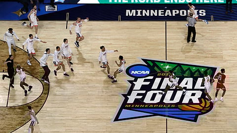 Virginia players celebrate after defeating Texas Tech 85-77 in overtime to win the men’s NCAA college basketball tournament, in Minneapolis. (AP Photo/Morry Gash) 