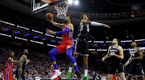 Philadelphia’s Ben Simmons goes up for a shot past Sacramento’s Willie Cauley-Stein on March 15 (Matt Slocum)