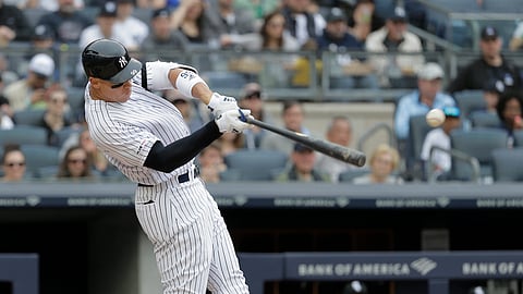 New York Yankees’ Aaron Judge hits an RBI single during the third inning of a baseball game against the Chicago White Sox on April 14, 2019.