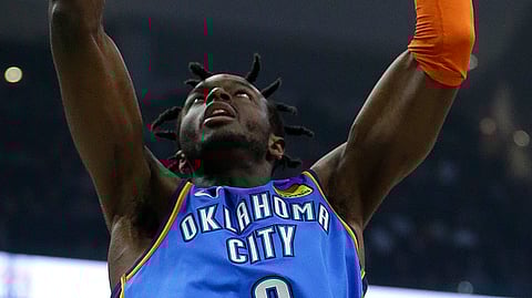 Oklahoma City Thunder’s Jerami Grant dunks during the first half of an NBA basketball game against the Milwaukee Bucks on April 10, 2019.