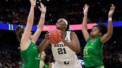 Baylor center Kalani Brown (21) looks for a shot between Oregon forwards Ruthy Hebard (24) and Erin Boley, left, during a Final Four semifinal of the NCAA women’s college basketball tournament on April 5, 2019.