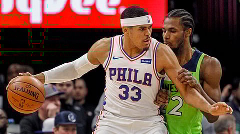 Philadelphia 76ers forward Tobias Harris works for position against Minnesota Timberwolves forward Andrew Wiggins in the game on March 30, 2019.