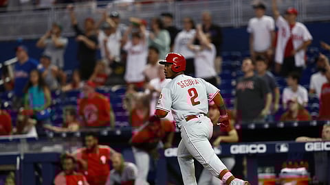 Philadelphia Phillies’ Jean Segura looks to the outfield after he hit a two run home run during the 14th inning of a baseball game against the Miami Marlins on April 14, 2019.