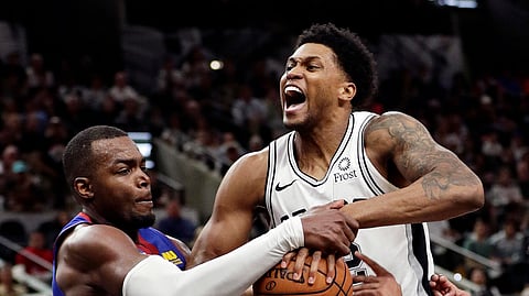Denver Nugget Paul Millsap, left, and San Antonio Spur Rudy Gay battle for control of the ball during Game 4. Will the Spurs be able to take control tonight. (AP Photo/Eric Gay)