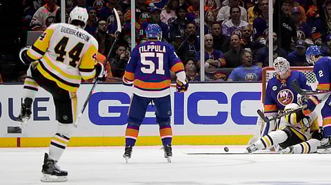 Penguins defenseman Erik Gudbranson celebrates his goal in Game 2 Friday (Julio Cortez)