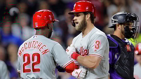 Phillies’ Bryce Harper (3) celebrates his three-run home run with Andrew McCutchen April 21 (Joe Mahoney)