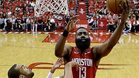 Houston Rockets guard James Harden drives to the basket as Utah Jazz center Rudy Gobert defends during Game 1 of their NBA basketball first-round playoff serieson April 14, 2019.