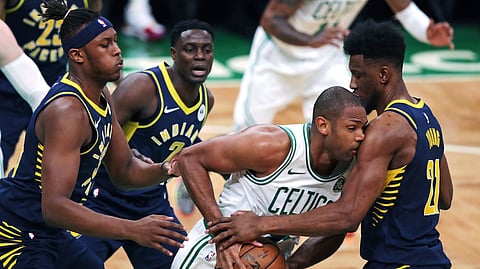 Boston Celtics center Al Horford, is trapped by Indiana Pacers forward Thaddeus Young during Game 2 on April 17 (Charles Krupa)