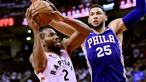 Toronto forward Kawhi Leonard looks for a shot against the Sixers’ Ben Simmons in Game 1 on April 27 (Frank Gunn/The Canadian Press)