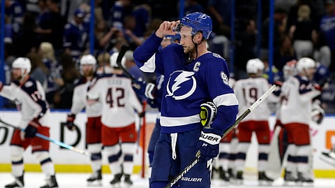 Tampa Bay Lightning center Steven Stamkos skates off as the Columbus Blue Jackets celebrate their 4-3 win during Game 1 in Tampa, Fla. (AP Photo/Chris O’Meara)