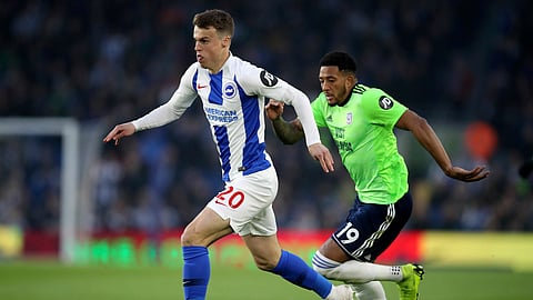 Brighton’s Jamie Paterson (left) and Cardiff City’s Nathaniel Mendez-Laing battle for the ball during the English Premier League soccer match  April 16 (Andrew Matthews)