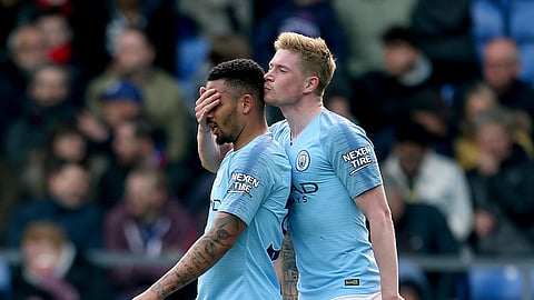 Manchester City’s Gabriel Jesus, left, celebrates scoring his side’s third goal of the game with teammate Kevin De Bruyne, during the English Premier League soccer match between Crystal Palace and Manchester City on April 14, 2019.