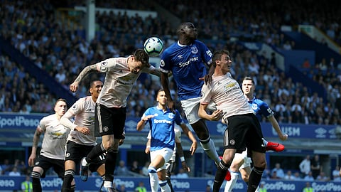 Manchester United’s Victor Lindelof, left, and teammate Nemanja Matic battle for the ball with Everton’s Kurt Zouma during the English Premier League soccer match on April 21, 2019.
