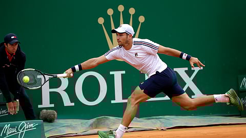 Dusan Lajovic returns a ball to Fabio Fognini during the men’s singles final match of the Monte Carlo Tennis Masters, Sunday, April, 21, 2019. (AP Photo/Claude Paris)