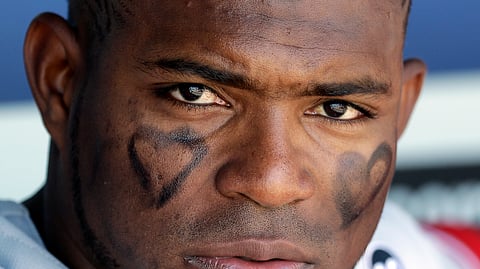 Cincinnati Reds’ Yasiel Puig watches from the dugout during the fifth inning of a baseball game against the Los Angeles Dodgers on April 17, 2019.
