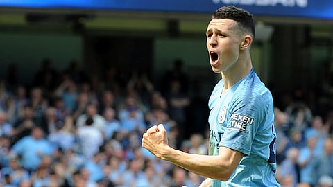 Manchester City’s Phill Foden celebrates his goal against Tottenham during the English Premier League soccer match between Manchester City and Tottenham Hotspur at Etihad stadium in Manchester, England, Saturday, April 20, 2019. (AP Photo/Rui Vieira)