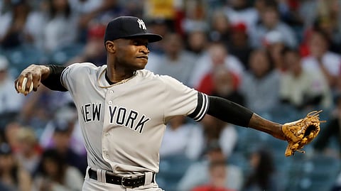 New York Yankees starting pitcher Domingo German throws against the Los Angeles Angels during the first inning of a baseball game in Anaheim, Calif., Tuesday, April 23, 2019. (AP Photo/Chris Carlson) 