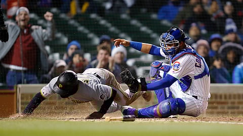 Pittsburgh Pirates Jason Martin is tagged out at home by Chicago Cubs catcher Willson Contreras during the seventh inning of a baseball game on April 10, 2019.