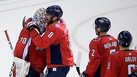 Capitals goalie Braden Holtby gets a hug from Alex Ovechkin. After tonight’s game will he deserve a hug from Incarcerated Bob? (AP Photo/Nick Wass)