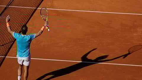 Rafael Nadal raises his racket after winning his match against Leonardo Mayer at the Barcelona Open , Wednesday, April 24, 2019. (AP Photo/Manu Fernandez)