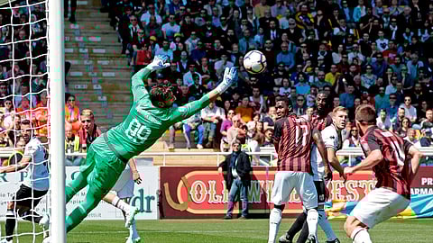 AC Milan’s Gianluigi Donnarumma makes a save in a Serie A soccer match between Parma and AC Milan n Parma, Italy, April 20, 2019. (Elisabetta Baracchi/ANSA via AP)