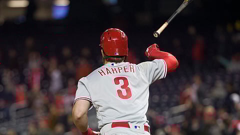 Philadelphia Phillies’ Bryce Harper flips his bat after hitting a two-run homer in the eighth inning of a baseball game against the Washington Nationals at Nationals Park on April 2, 2019.