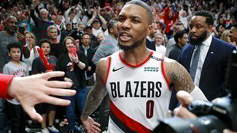 Portland Trail Blazers’ Damian Lillard leaves the court after hitting the game-winning three-pointer to beat the Oklahoma City Thunder 118-115 in Game 5 of their best-of-seven first-round playoff series on Tuesday, April 23, 2019. 