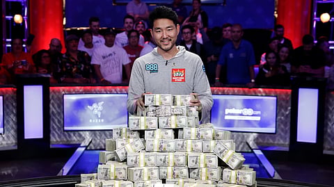 FILE - In this July 15, 2018, file photo, John Cynn poses after winning the World Series of Poker main event in Las Vegas. The 50th edition of World Series of Poker is kicking off in Las Vegas. The seven-week poker festival that opens Tuesday, May 28, 2019, will feature 89 events with an expected combined prize pool of more than $200 million. (AP Photo/John Locher, file)