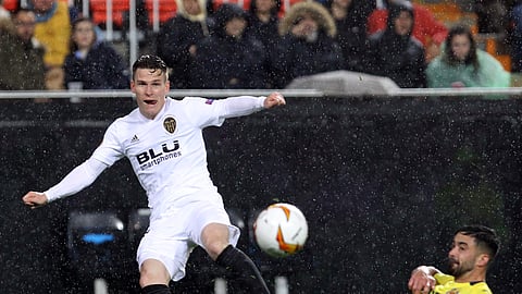 Villarreal’s Jaume Costa, right, tries to block a shot from Valencia forward Kevin Gameiro during the Europa League quarterfinals, 2nd leg, soccer match between Valencia and Villarreal on April 18, 2019.