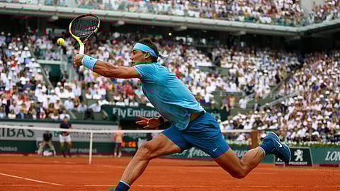In this June 10, 2018 photo, Spain’s Rafael Nadal returns the ball to Austria’s Dominic Thiem during the men’s final match of the French Open tennis tournament at the Roland Garros stadium in Paris.