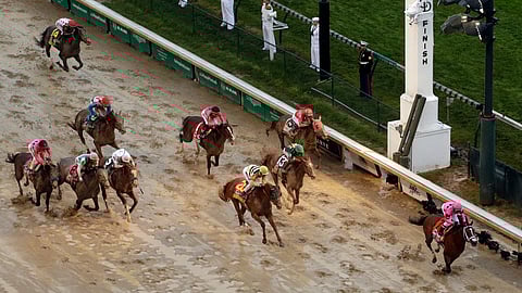 Luis Saez rides Maximum Security to the finish line first against Flavien Prat on Country House during the 145th running of the Kentucky Derby horse race at Churchill Downs Saturday, May 4, 2019, in Louisville, Ky. Country House was declared the winner after Maximum Security was disqualified following a review by race stewards. (AP Photo/Charlie Riedel)