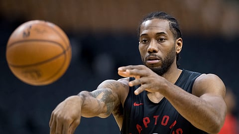 Toronto Raptors’ Kawhi Leonard passes during practice for the NBA Finals in Toronto on May 29, 2019. Game 1 of the NBA Finals between the Raptors and Golden State Warriors is Thursday in Toronto.