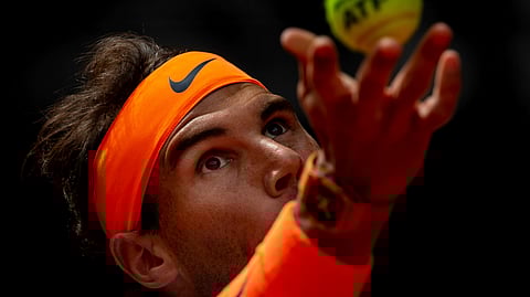 Rafael Nadal, from Spain, serves to Felix Auger-Aliassime, from Canada, during the Madrid Open tennis match in Madrid, Wednesday, May 8, 2019. (AP Photo/Bernat Armangue)