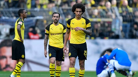 Dortmund’s Axel Witsel and Dortmund’s Paco Alcacer leave the pitch disappointed after losing the German Bundesliga soccer match between Borussia Dortmund and FC Schalke 04, Saturday, April 27, 2019.  (AP Photo/Martin Meissner)
