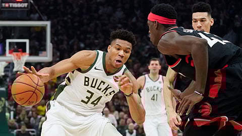 Milwaukee Bucks’ Giannis Antetokounmpo tries to drive past Toronto Raptors’ Pascal Siakam during the first half of Game 2 of the NBA Eastern Conference basketball playoff finals Friday, May 17, 2019, in Milwaukee. (AP Photo/Morry Gash)