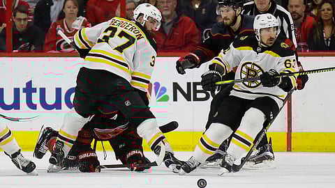 Bruins’ Patrice Bergeron (37) and Brad Marchand look for the puck in Game 3 on May 14 (Gerry Broome)
