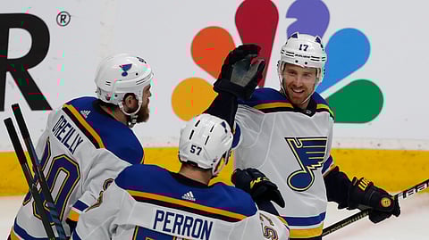 St. Louis Blues’ Ryan O’Reilly, David Perron, celebrate with Jaden Schwartz, who scored a goal against the San Jose Sharks in the third period in Game 5 of the NHL hockey Stanley Cup Western Conference finals on May 19, 2019.