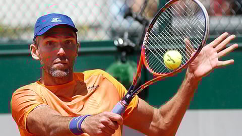 Croatia’s Ivo Karlovic plays a shot against Spain’s Feliciano Lopez during their first round match of the French Open tennis tournament at the Roland Garros stadium in Paris, Tuesday, May 28, 2019. When 40-year-old Karlovic and 37-year-old Lopez played each other at the French Open on Tuesday, it marked a record for combined age between opponents at Roland Garros in the Open Era. (AP Photo/Pavel Golovkin)