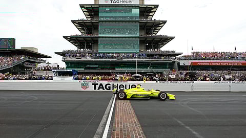 Simon Pagenaud, of France, crosses the start/finish line on the start of the Indianapolis 500 IndyCar auto race at Indianapolis Motor Speedway, Sunday, May 26, 2019, in Indianapolis. (AP Photo/Rob Baker)