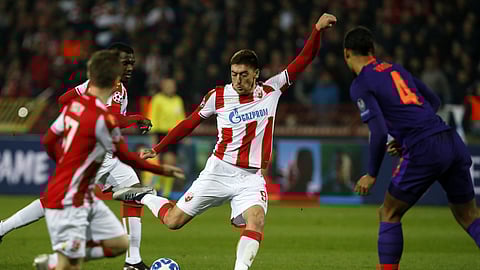 Red Star’s Milan Pavkov, center, scores his side’s second goal during the Champions League group C soccer match between Red Star and Liverpool at Rajko Mitic stadium in Belgrade on Nov. 6, 2018.