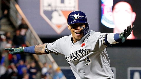 Milwaukee Brewers’ Orlando Arcia celebrates as he rounds third base on his two-run home run off Minnesota Twins pitcher Taylor Rogers in the eighth inning of a baseball game on May 27, 2019.