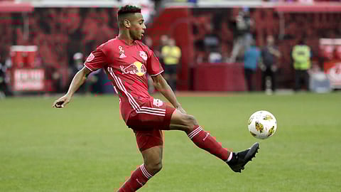 In this Sept. 22, 2018, file photo, New York Red Bulls midfielder Tyler Adams kicks the ball against Toronto FC during the second half of a soccer game in Harrison, N.J.
