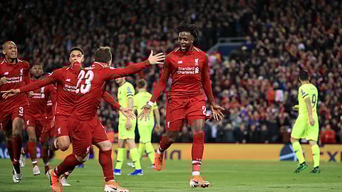 Liverpool’s Divock Origi, center, celebrates scoring his side’s fourth goal of the game during the Champions League Semi Final, second leg soccer match between Liverpool and Barcelona on Tuesday, May 7, 2019.