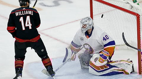 Carolina Hurricanes’ Justin Williams scores the game-winning goal against New York Islanders goalie Robin Lehner, of Sweden, during Game 3 of the NHL hockey second-round playoff series on May 1, 2019.