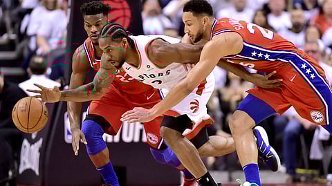 Sixers guard Jimmy Butler (23) and teammate Ben Simmons pressure Toronto forward Kawhi Leonard in Game 7 on May 12 (Frank Gunn/The Canadian Press) 