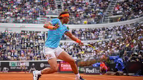Rafael Nadal of Spain returns the ball to Stefanos Tsitsipas of Greece during a semifinal match at the Italian Open tennis tournament, in Rome, Saturday, May 18, 2019. (AP Photo/Andrew Medichini)