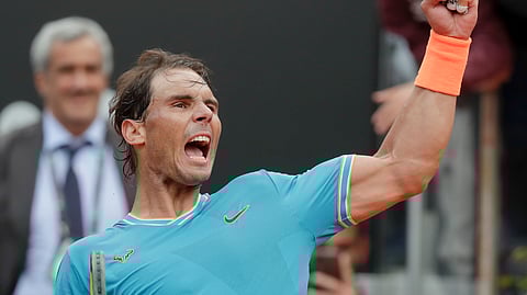Rafael Nadal of Spain celebrates after defeating Stefanos Tsitsipas of Greece during a semifinal match at the Italian Open tennis tournament on May 18, 2019.