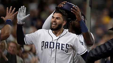 San Diego Padres’ Eric Hosmer is congratulated by teammates after hitting a two-run home run during the sixth inning of the team’s baseball game against the Arizona Diamondbacks, Tuesday, May 21, 2019, in San Diego. (AP Photo/Gregory Bull)